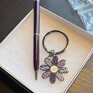 Coach Purple and Silver mini pen and a daisy Floral Coach Keychain.NWOT.